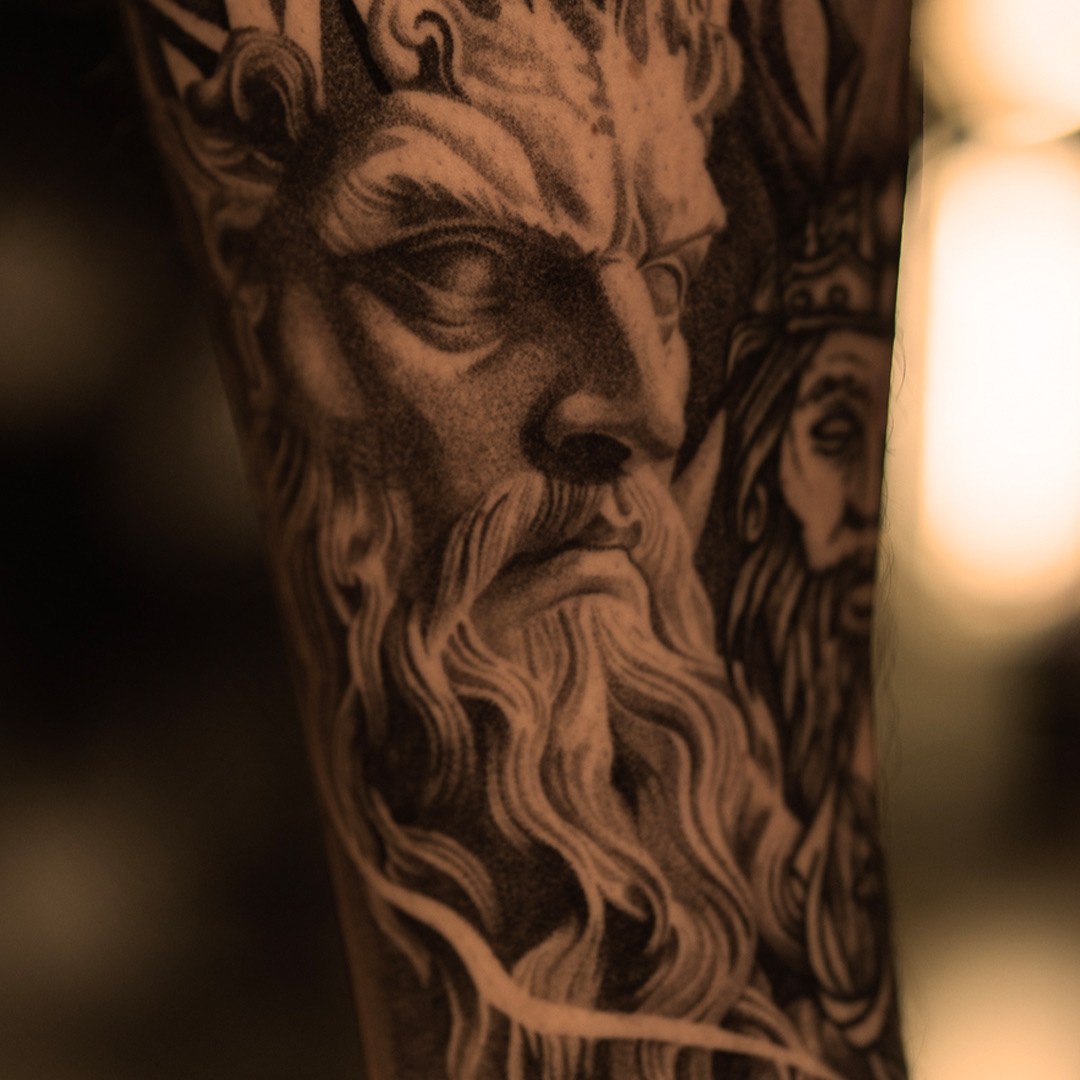 Crowned bearded god statue tattoo in black and grey realism by Jon LaFlore, Dallas TX