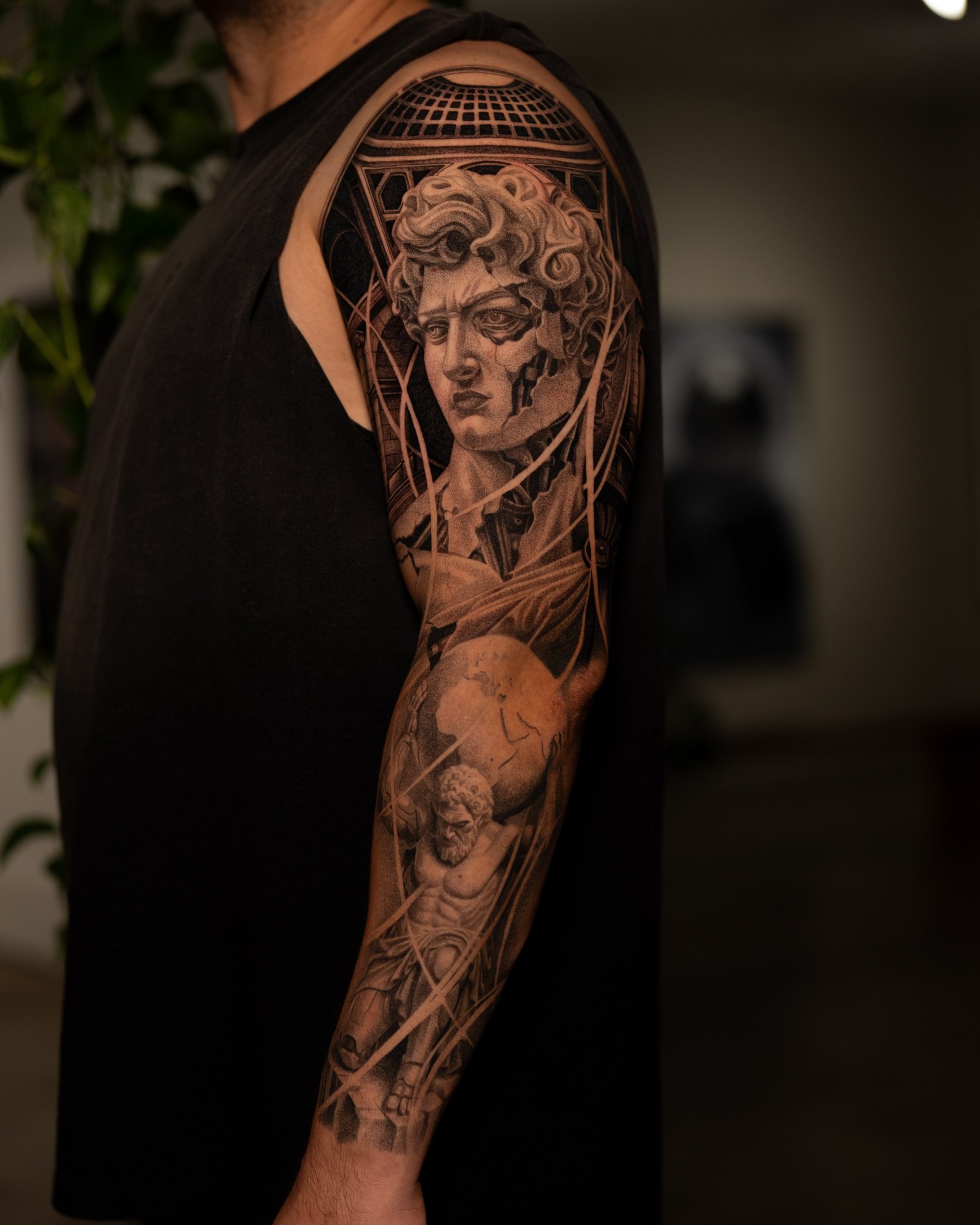 David and Atlas classical statue full-sleeve tattoo in black and grey realism by Jon LaFlore, Dallas TX
